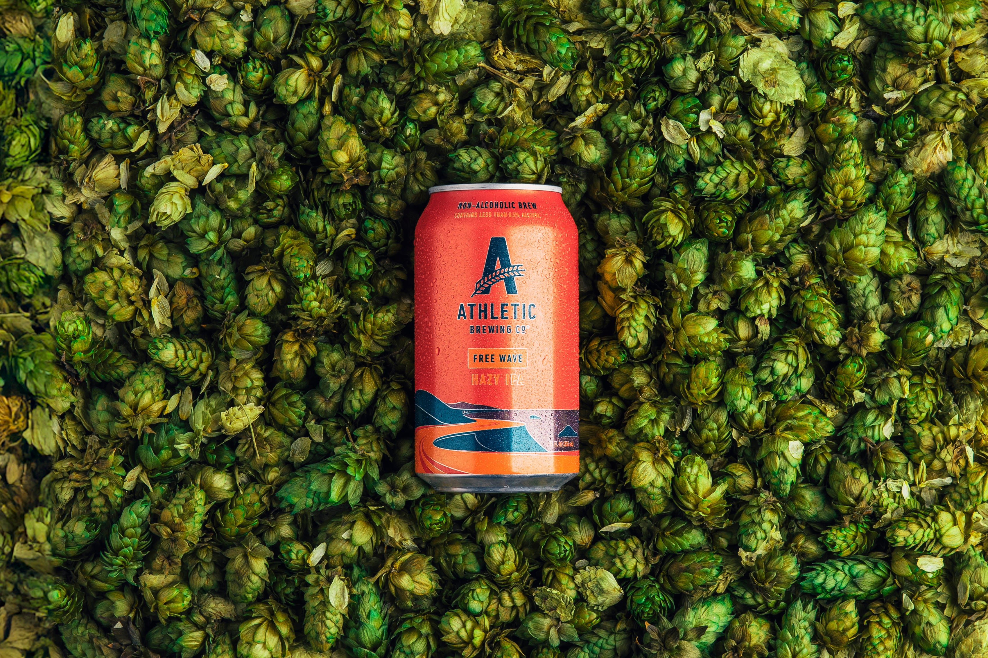 Can of Free Wave on top of a bed of Hops